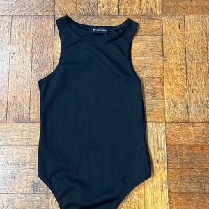 Black sleeveless bodysuit- never worn! Size 2.